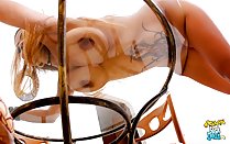 Bending over glass table big breasts
