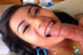 Poy licking spent cock on her back