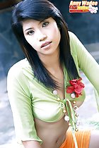 Anny Wadee in green top and orange skirt long hair