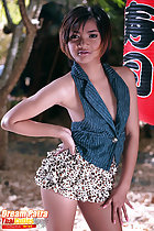 Standing with hand on hip wearing short skirt